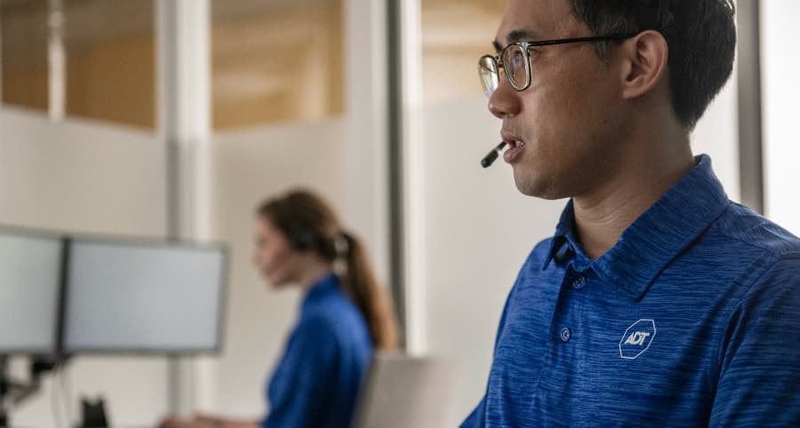 ADT team member in a monitoring station